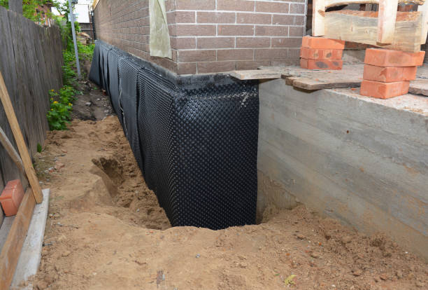 Happy homeowners after waterproofing job in Piney Flats
